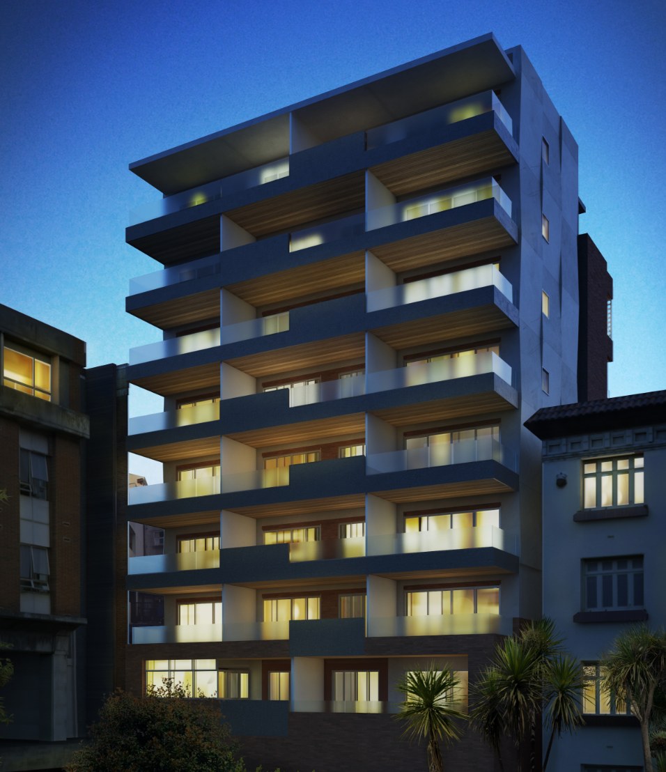 The CMP apartment block at dusk, balconies lit across every level.