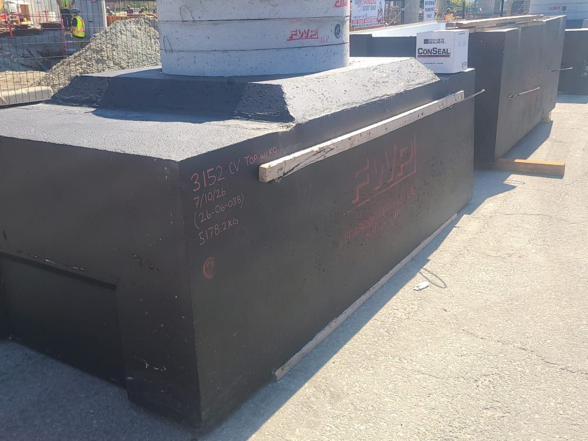 A Fraserway Prekast custom structure marked up with its piece number, pour date and weight