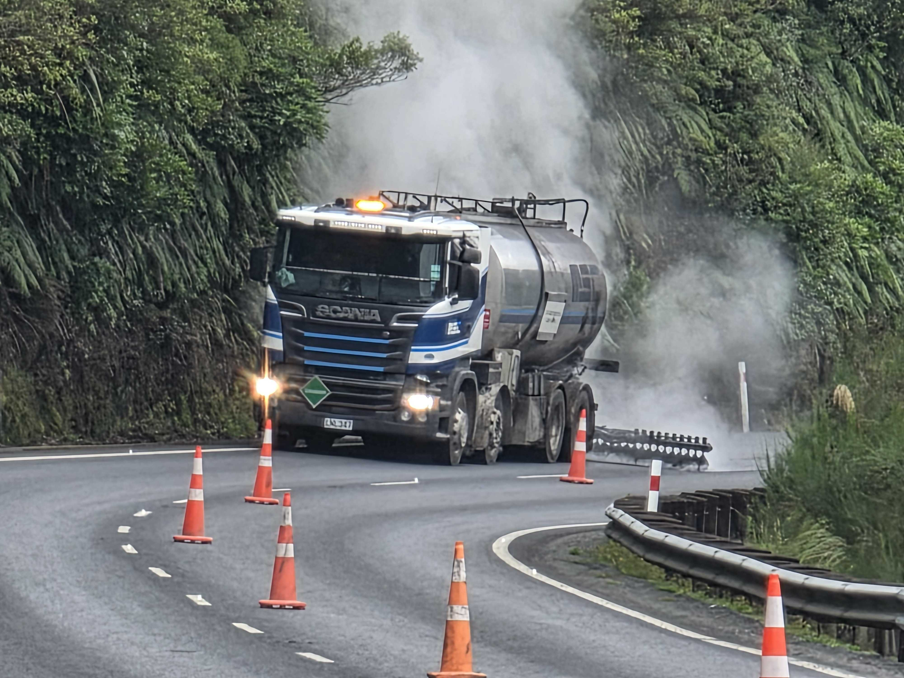 A bitumen sprayer applying binder on a state highway reseal